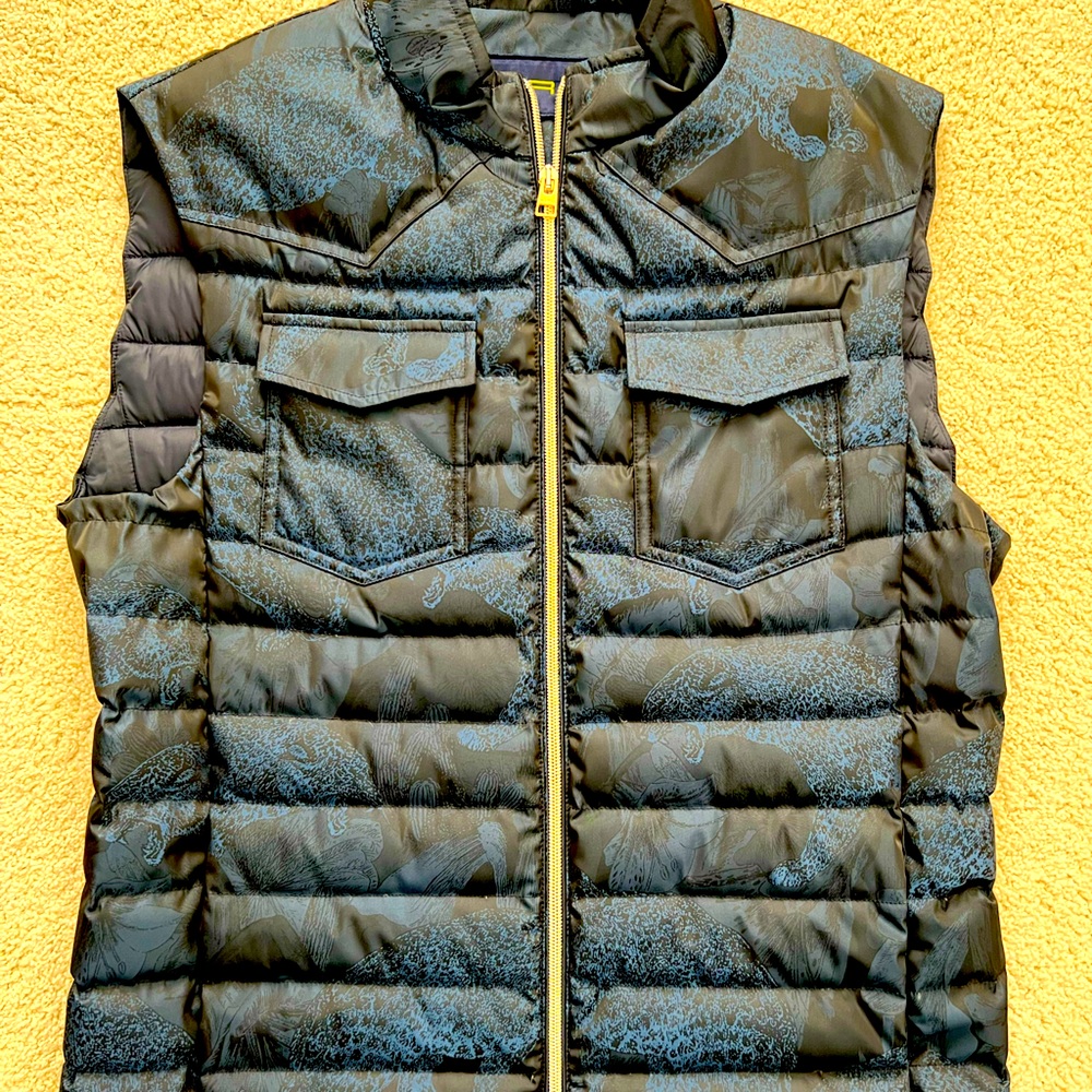 Stunning new without tags at throw down filled vest. Size medium lightweight.